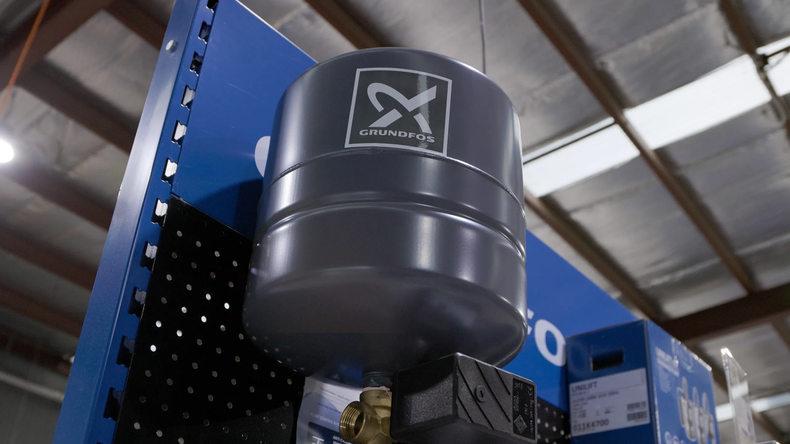 Midland Irrigation service truck parked at residential property during professional sprinkler system installation with pop-up sprinklers watering lawn