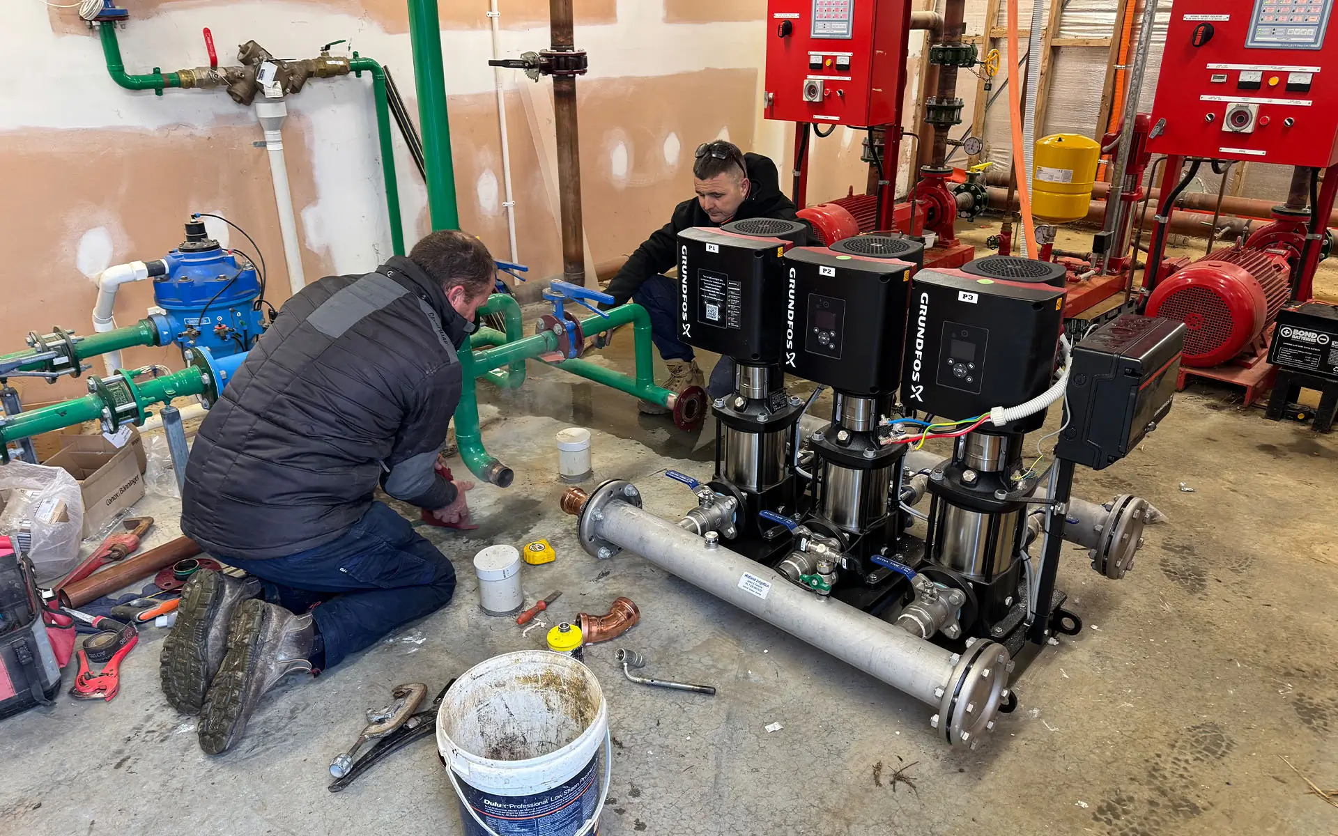 midland-irrigation-pump-installation-L251124 Hunter MP Rotator nozzle sprinkler head with blue top spraying multiple water streams in radial pattern for efficient lawn irrigation