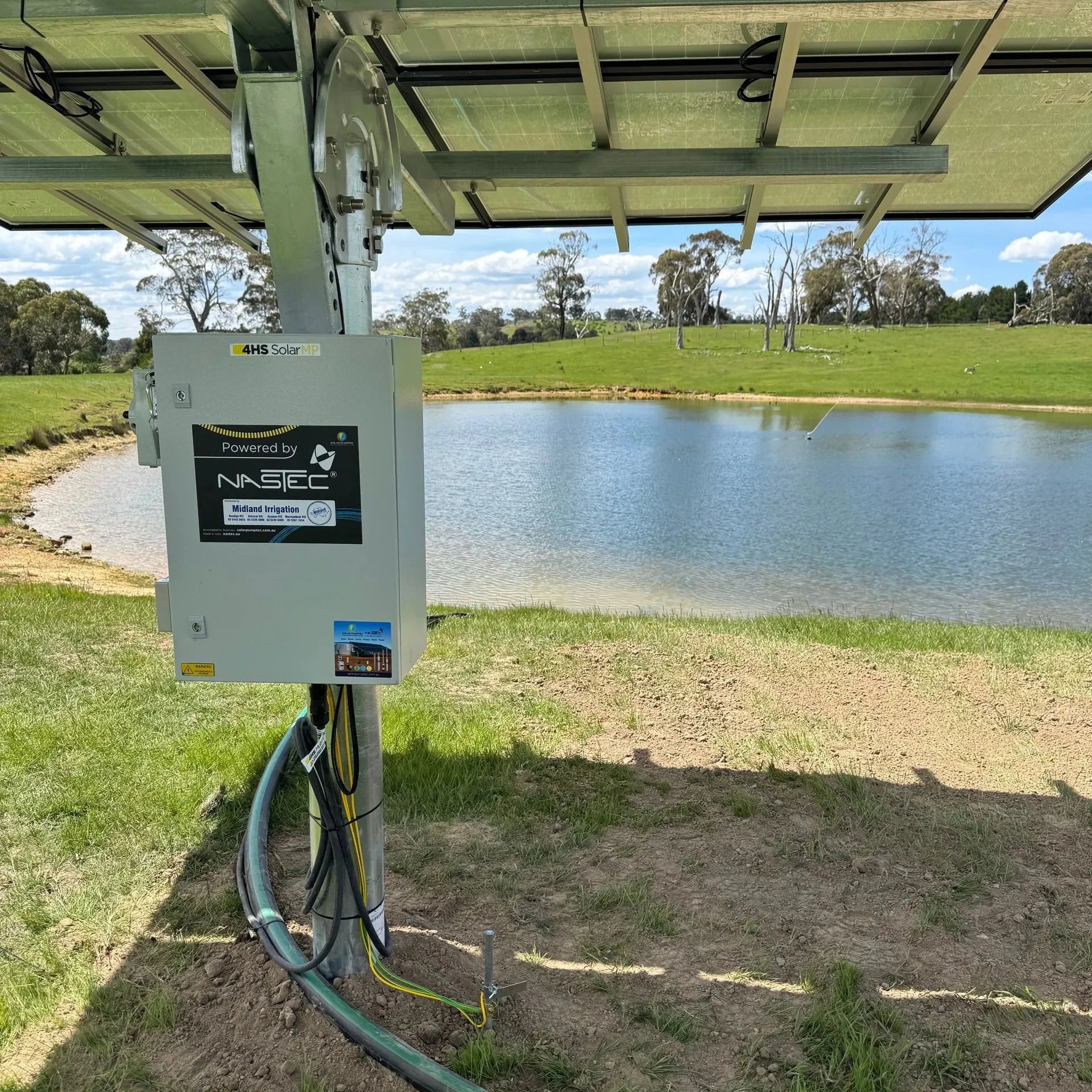 midland-solar-pumps-control-box-installation-farm-dam-P260209 Solar pump control box and inverter installed beneath panel array at farm dam, showing professional installation by Midland Irrigation
